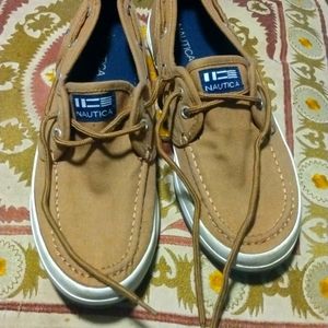 Nautica kids shoes color is tan with blue nautical emblem size 5 youth